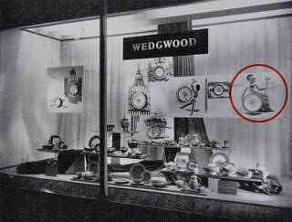 Black and white photograph of shop front filled with ceramics